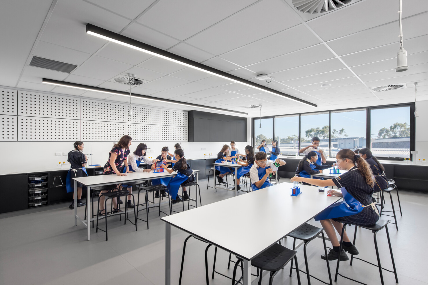 Science labs on the upper level continue the graphic black and white minimalist aesthetic of the Learning Building