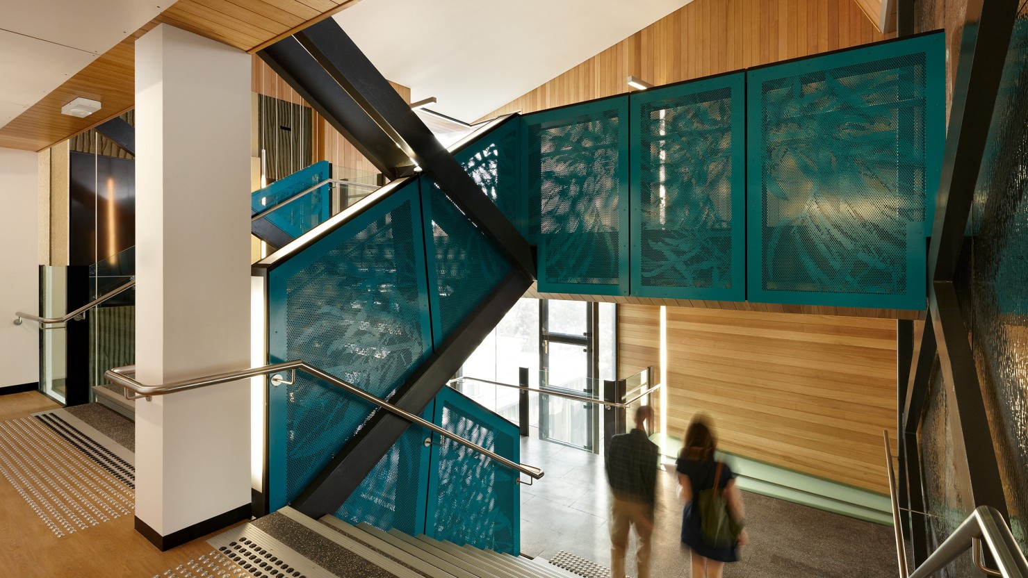 Monash University Menzies, two people walking down stairs