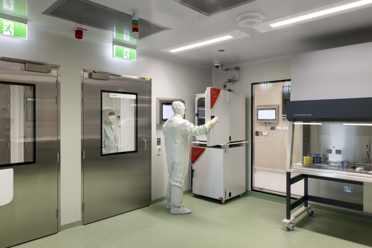 a cleanroom with appliances and green floor
