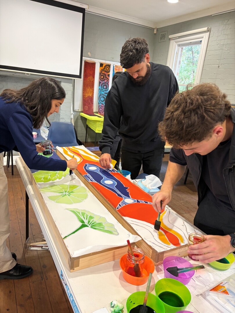 Members from DesignInc Sydney and Nguluway DesignInc embrace "coming together as one" for NAIDOC Week 2026.